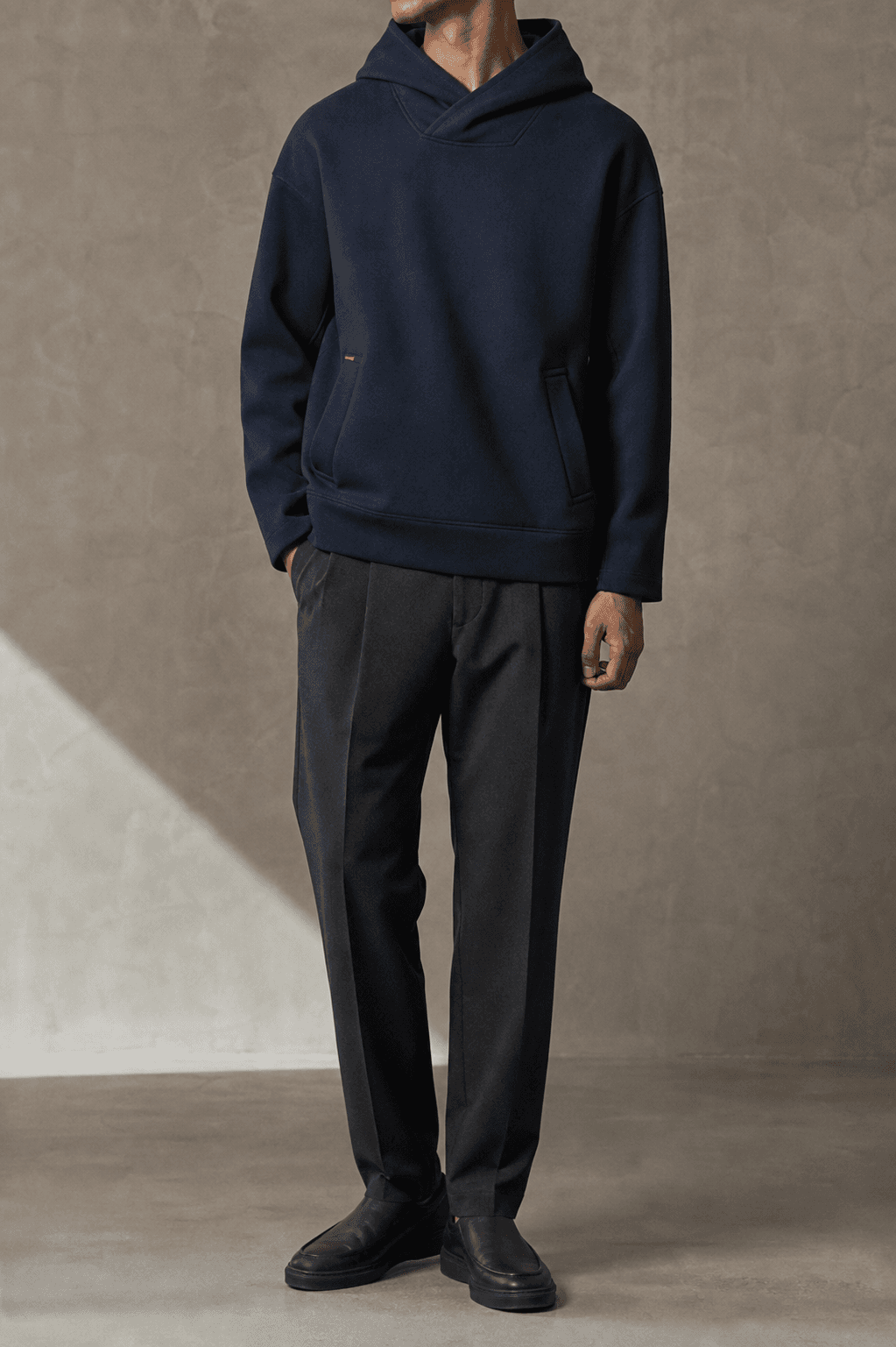 Man wearing the midnight ocean Ledge Hoodie