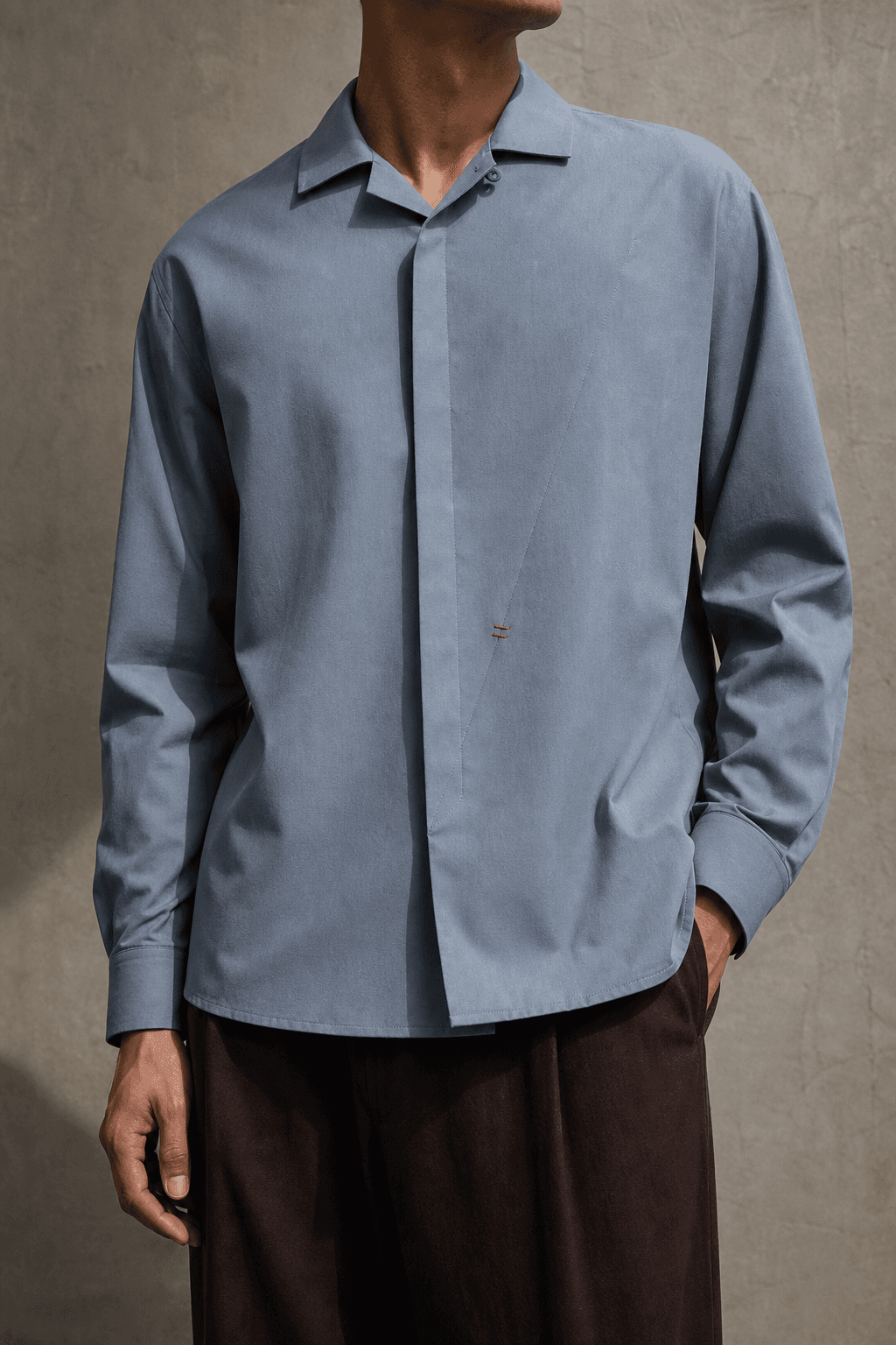 Man wearing the dusty mineral blue Rill Convertible Shirt