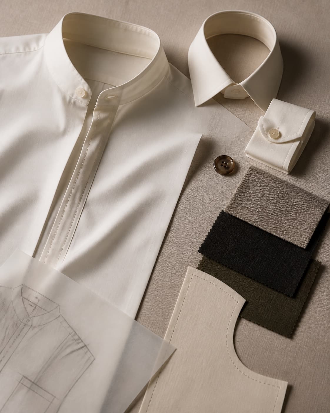 Custom shirt details, fabric swatches, and pattern pieces arranged on a worktable